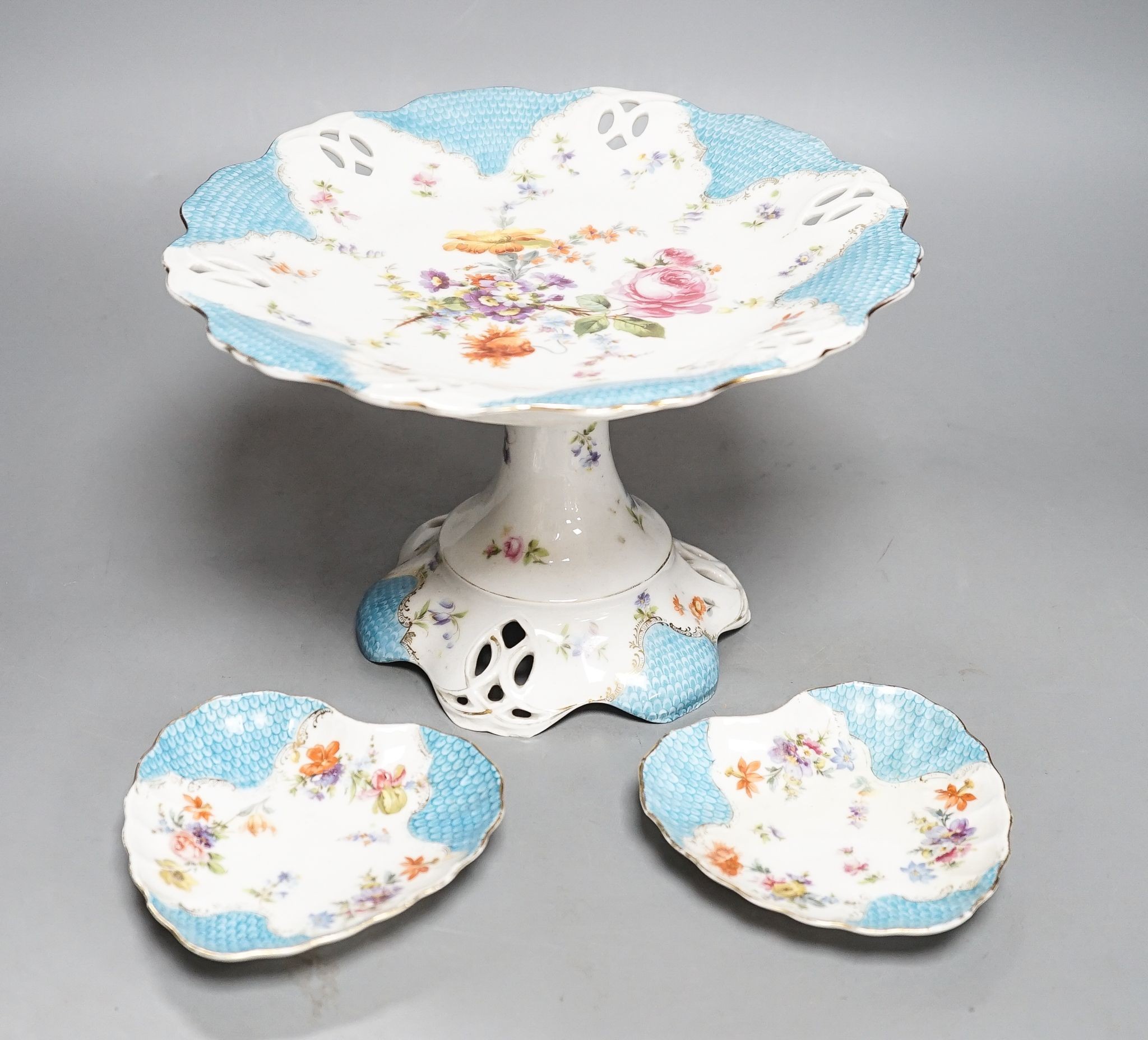 A floral and gilt dessert set, comprising of: 3 comports, 10 plates and 6 assorted dishes.